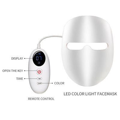 Maschera di protezione infrarossa tenuta in mano di terapia della foto della luce di 7 colori LED